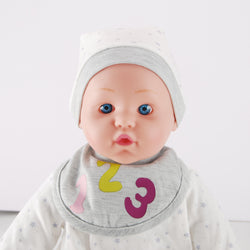 Side view of WeFriends baby doll showing star romper and cap details